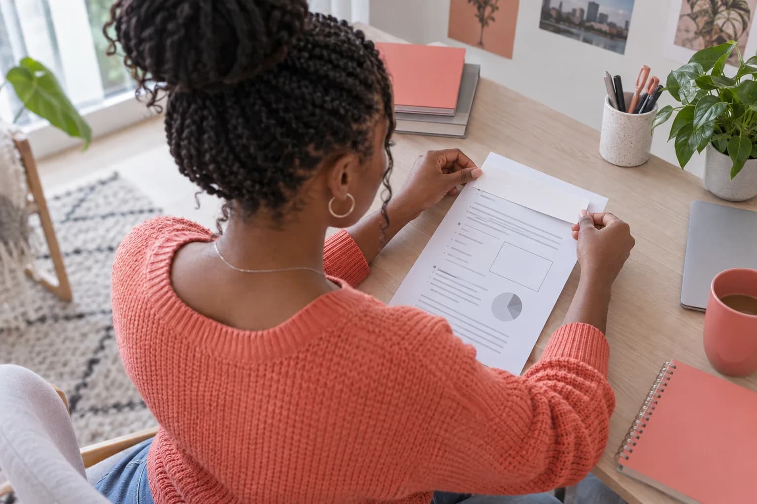 Student covering an unnecessary header area on a printed worksheet before sharing